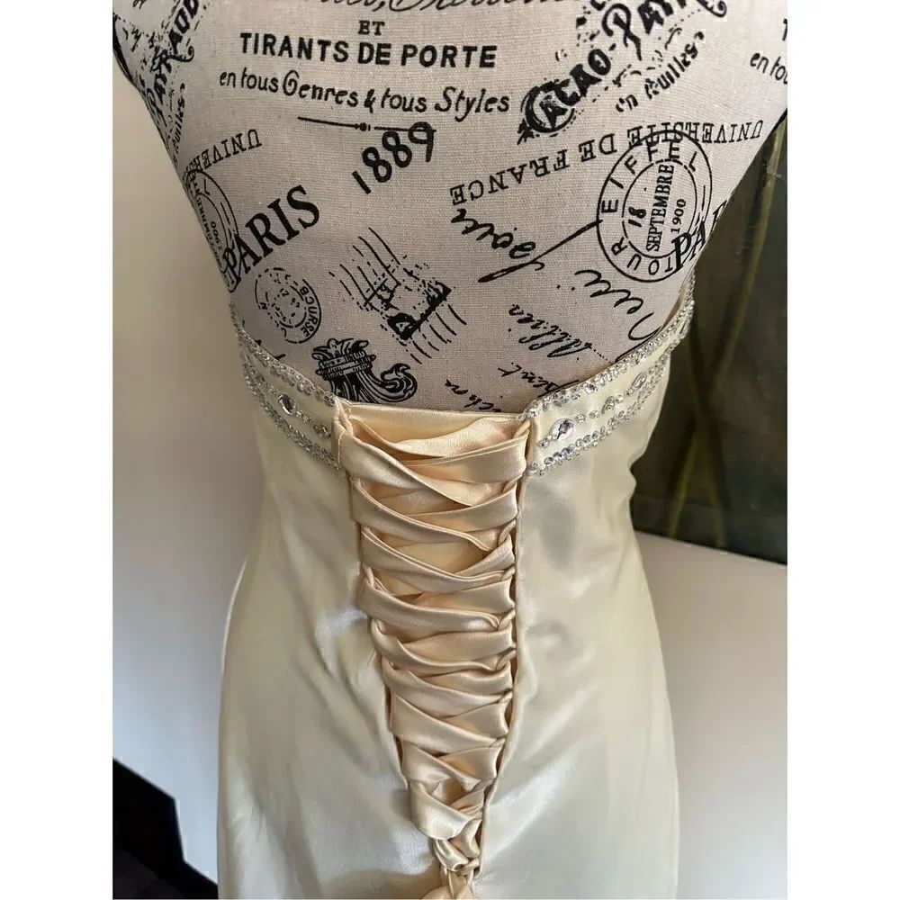 Stunning light yellow strapless gown , lace up back silk feel retails over $300